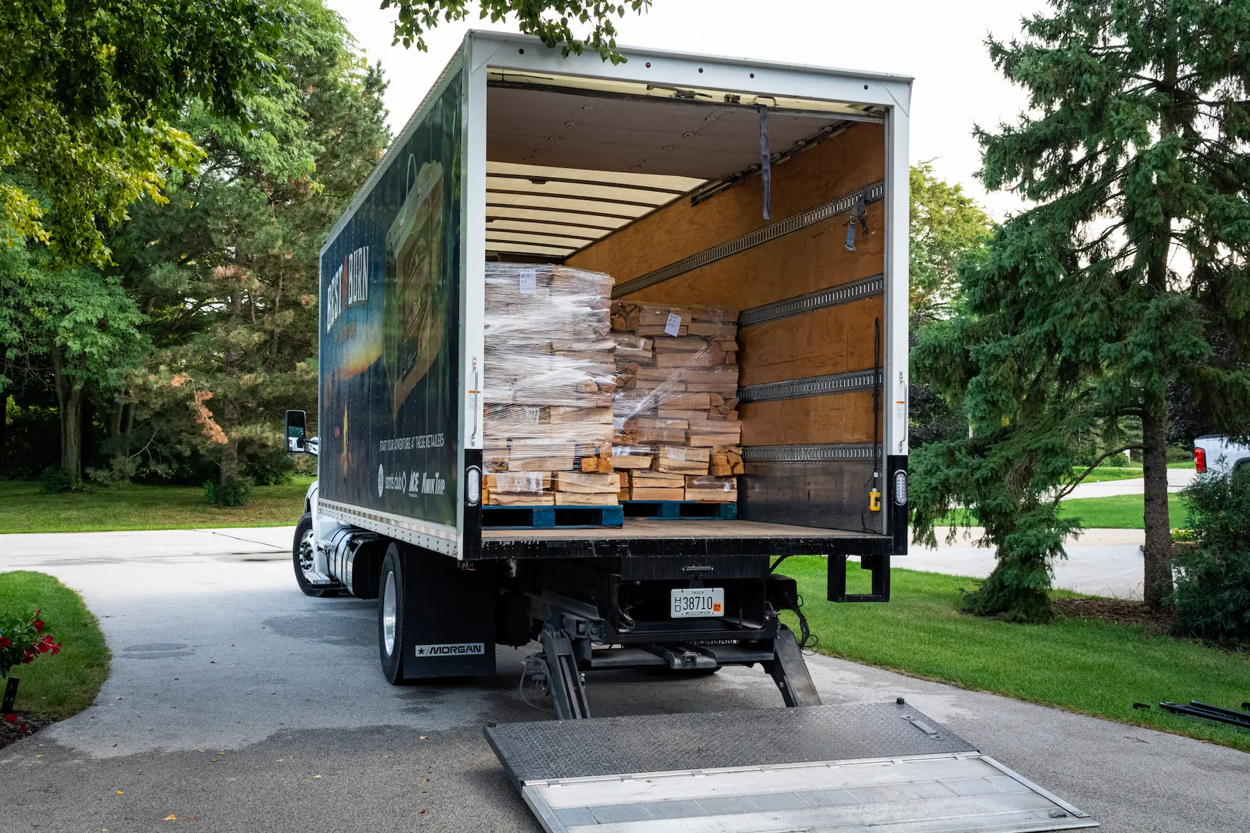 Pallet of firewood bundles on the truck liftgate during a Best Burn Firewood delivery